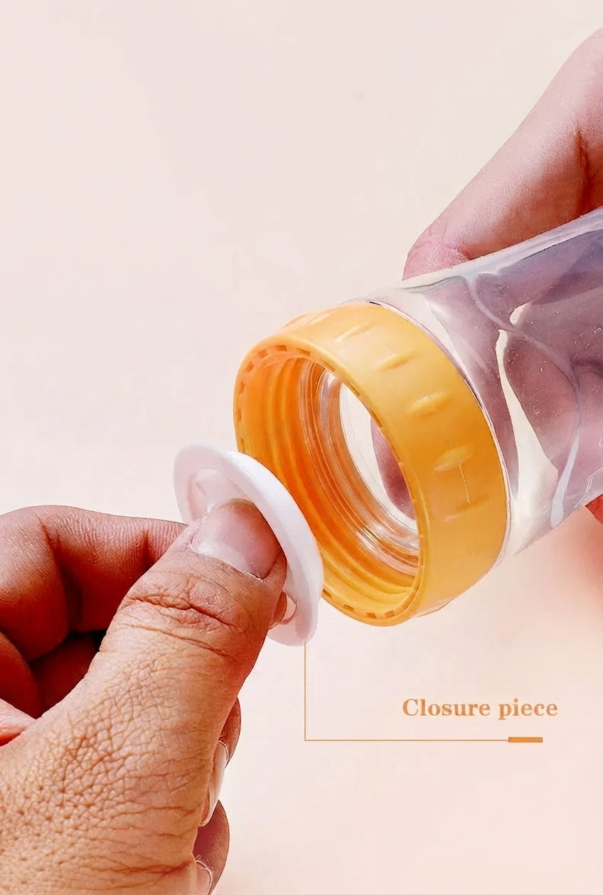NomNom™ Silicone Baby Feeding Bottle with Spoon